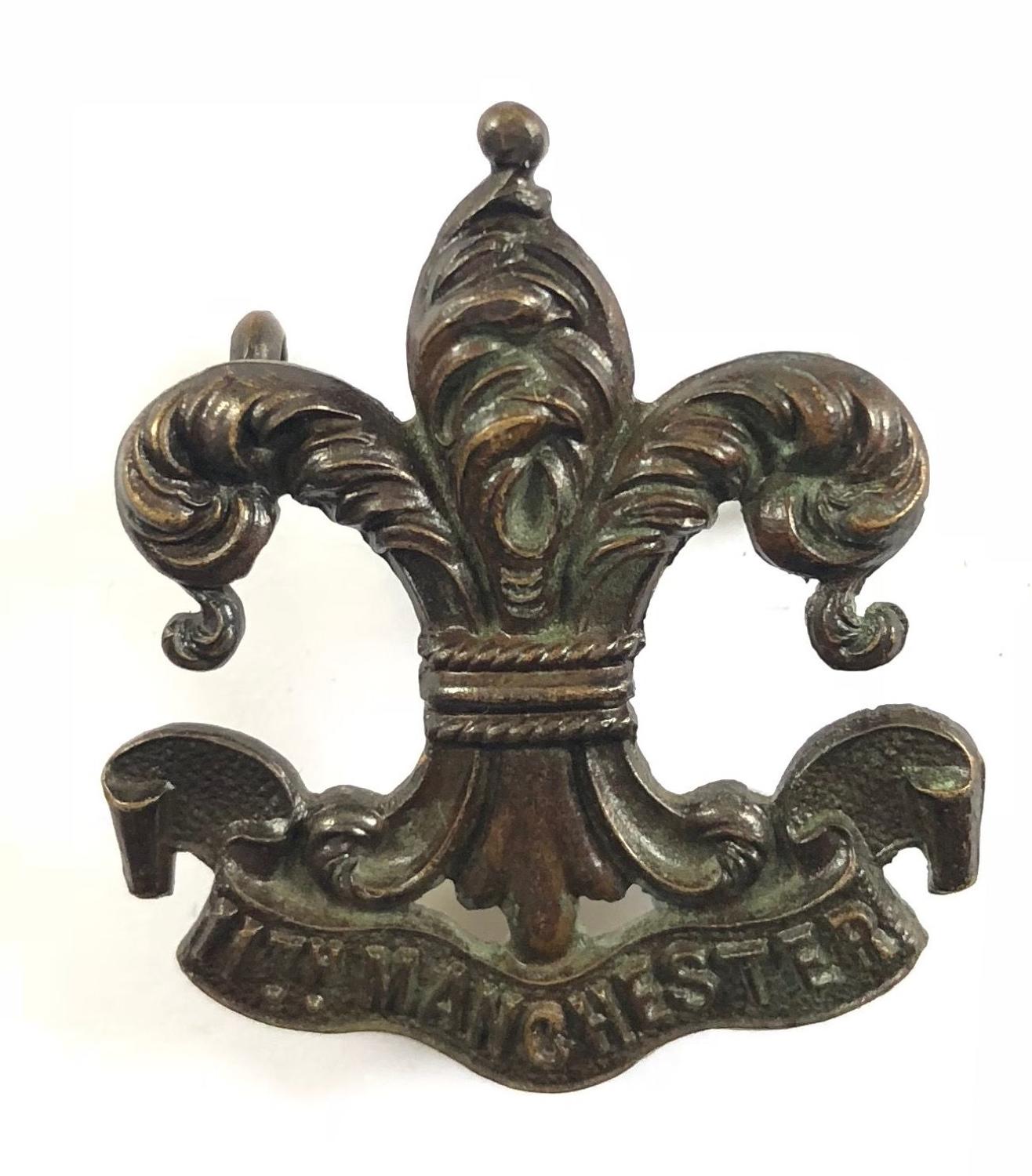 11th (Service) Bn. Manchester Regiment rare WW1 bronze cap badge.