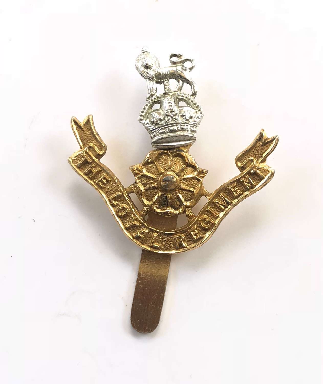 The Loyal Regiment King’s Crown anodised cap badge.