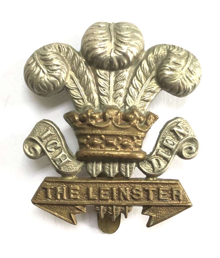 Irish. Leinster Regiment WW1 curled scrolls OR’s bi-metal cap badge