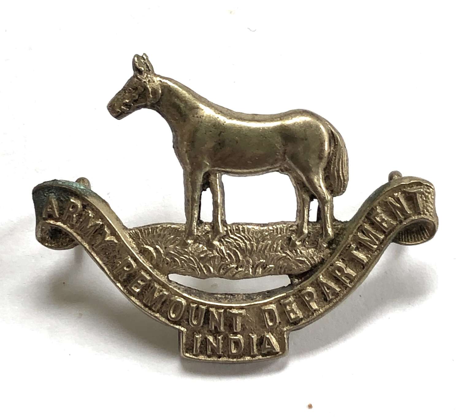 Army Remount Department India Officer’s cap badge by J.R. Gaunt.