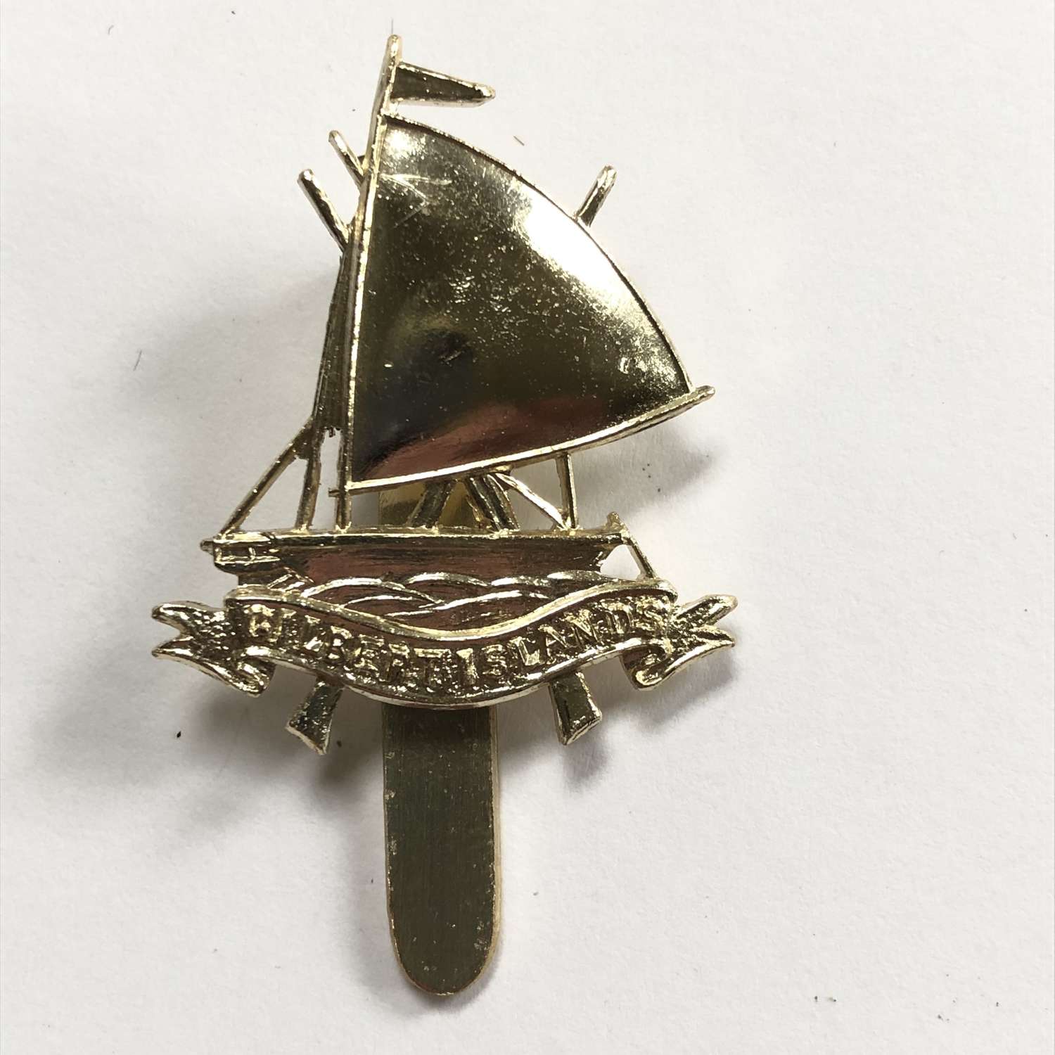 Gilbert Islands Defence Force anodised cap badge