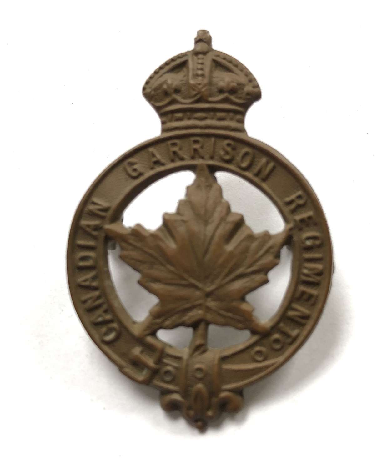 WW1 Canadian Garrison Regiment cap badge by Caron