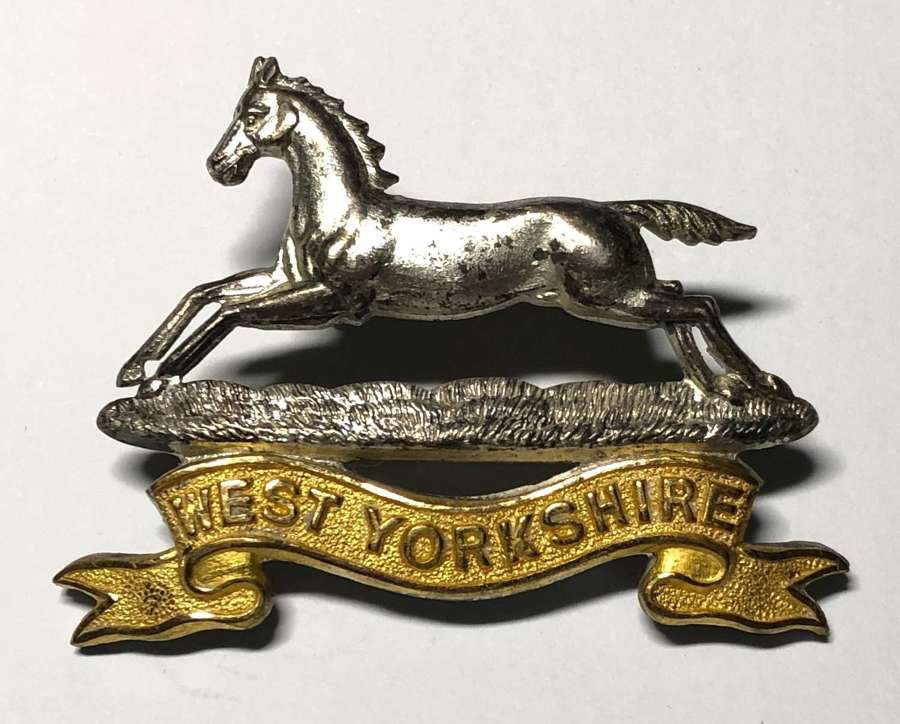 PWO West Yorkshire Regiment Officer's cap badge by JR Gaunt London