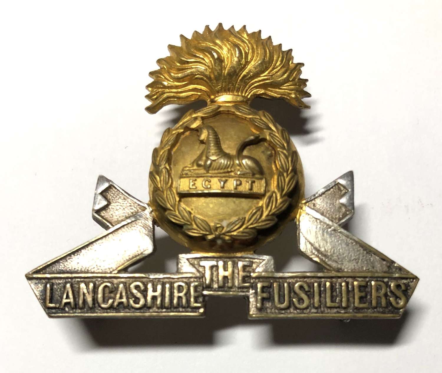 Lancashire Fusiliers Officer's cap badge by J.R. Gaunt, London